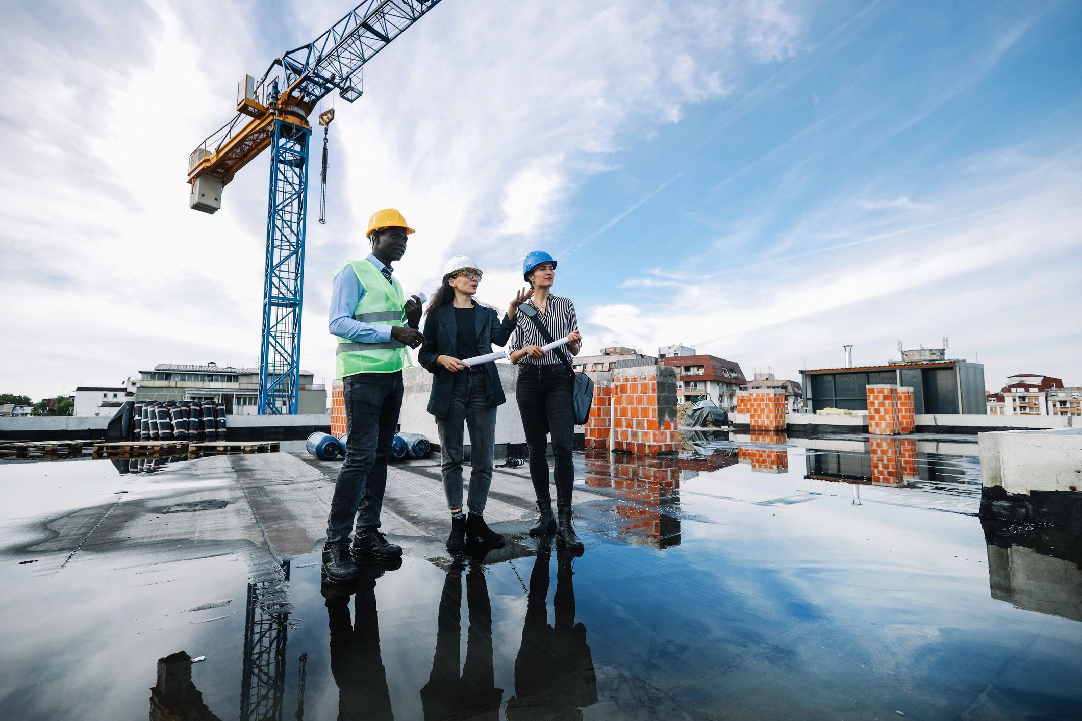 Construction professionals reviewing plans on site